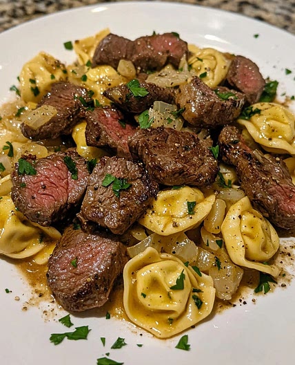 Savory Cheesesteak Tortellini in creamy provolone sauce