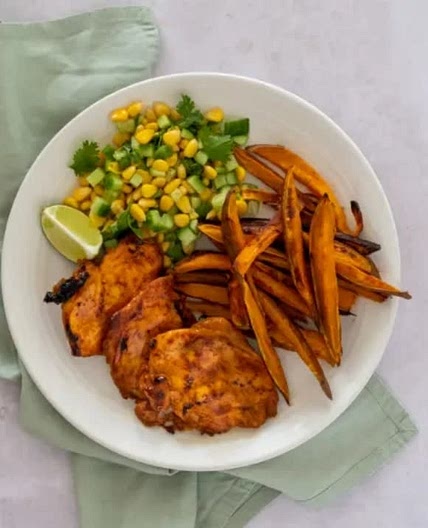 Sweet potato air fryer chips with seasoned chicken breast and peas