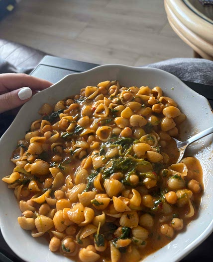 Brothy pasta with beans and greens