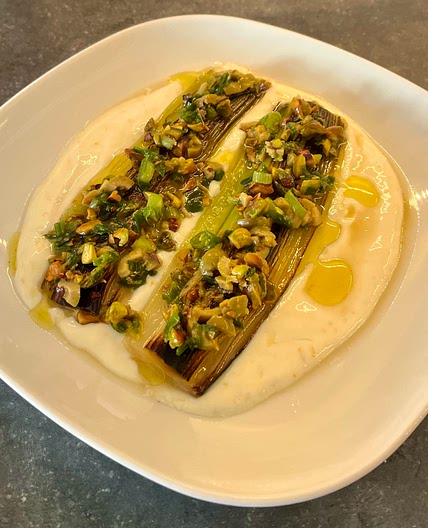 Caramelised leeks with olives and pistachio dressing