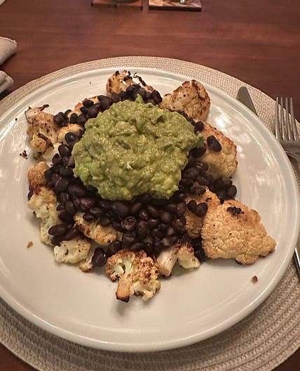 Cauliflower steak with black beans and diced tomatoes