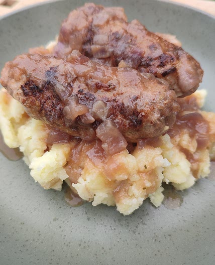 (Bangers & Mash) - Homemade Sausages, Smashed Jersey Royals & Onion Gravy
