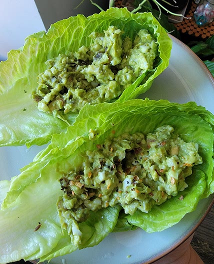 Romaine lettuce boats filled with guacamole - The Plant Paradox