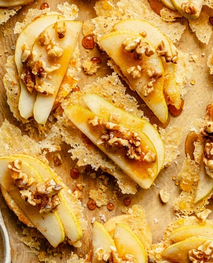 Parmesan crusted crostini with pear and walnut