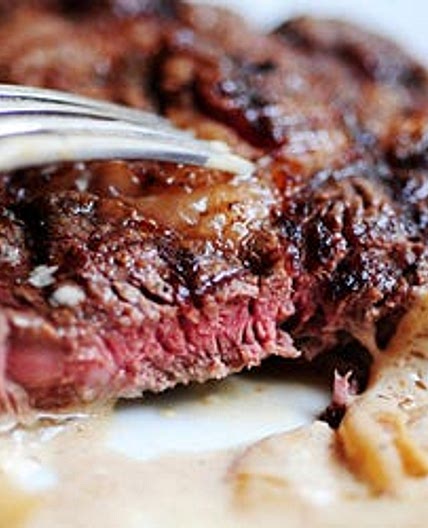 Grilled Ribeye Steak with Onion-Blue Cheese Sauce