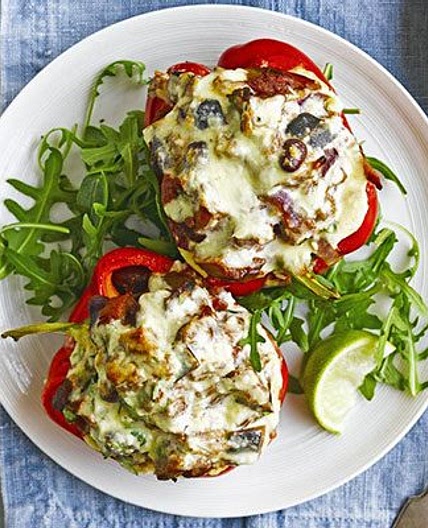 Vegetarian chilli-stuffed peppers with feta topping