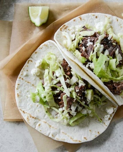 Crockpot Short Rib Tacos with Salted Lime Cabbage and Queso Fresco