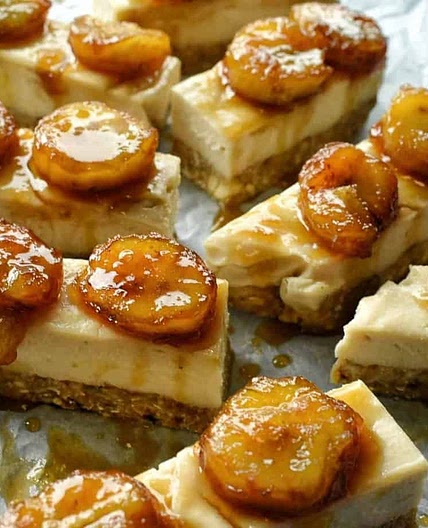 Raw coconut cheesecake bars with rum flambe bananas