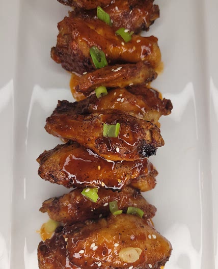 Air Fryer Chicken Wings Tossed In BBQ Rum Sauce