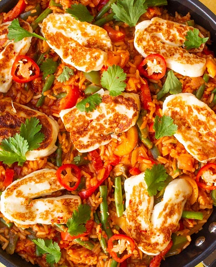Spicy Tomato Rice topped with Halloumi and Coriander
