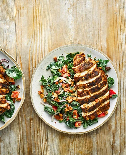 Cumin-crusted chicken with kale salad and hummus dressing
