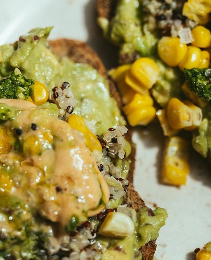 Avocado on toast with quinoa, maize and pesto