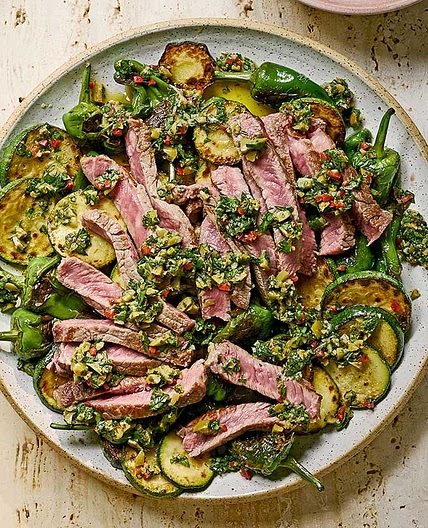 Olive chimichurri steak with padron peppers