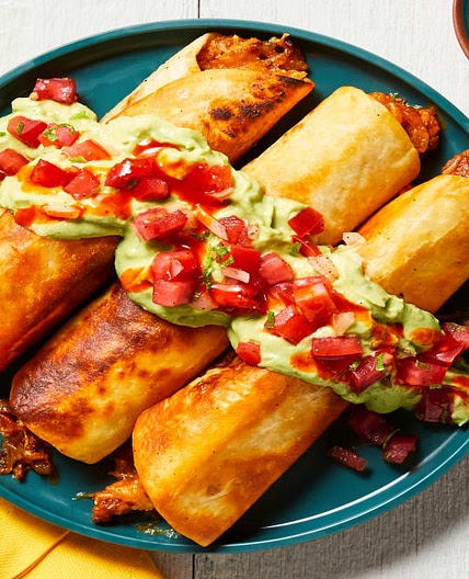 Fully Loaded Pork Taquitos with Pico de Gallo, Creamy Guacamole & Hot Sauce