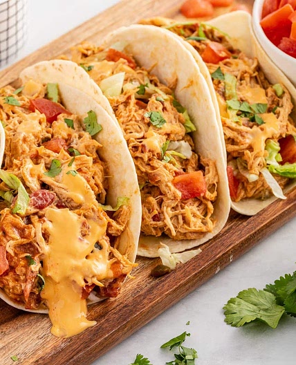 Slow Cooker Queso Chicken Tacos