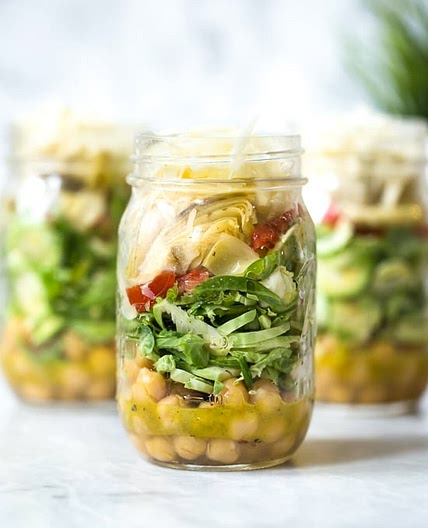 Raw Brussels Sprouts and Chickpea Salad in a Jar with Artichokes, Sun Dried Tomatoes and Asiago