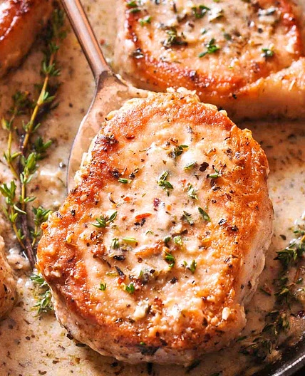 Boneless Pork Chops in Creamy Garlic and Herb Wine Sauce