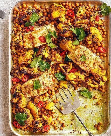 Curried butter-baked cod with cauliflower & chickpeas