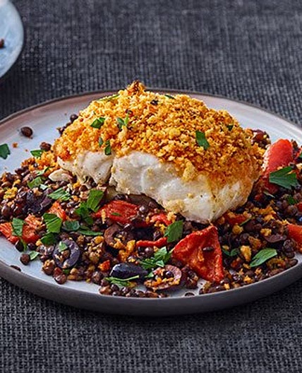 Harissa-crumbed fish with lentils & peppers