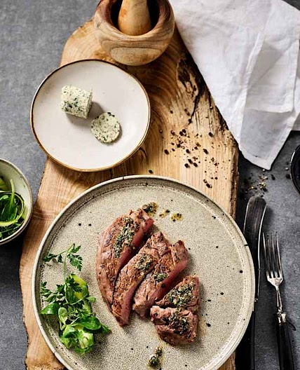 Rare beef steak with herb garlic butter