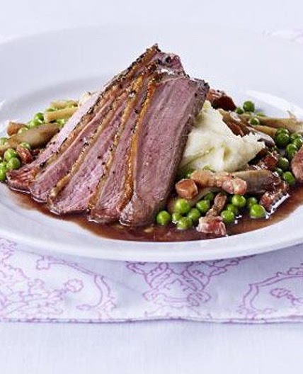 Peppered duck with vanilla mash, pea & wild mushroom ragout