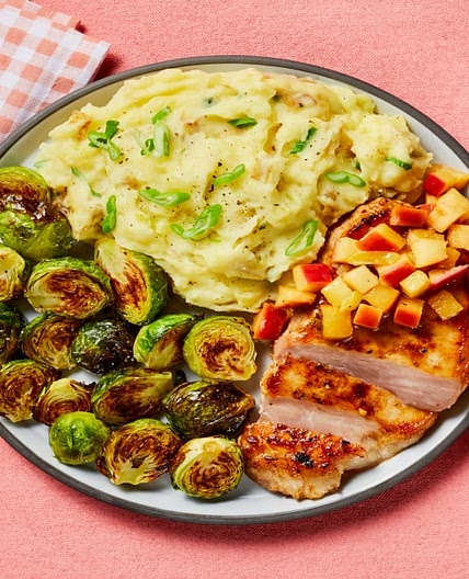 Brown Sugar Bourbon Pork Chops with Apple Pan Sauce, Scallion Mashed Potatoes & Brussels Sprouts