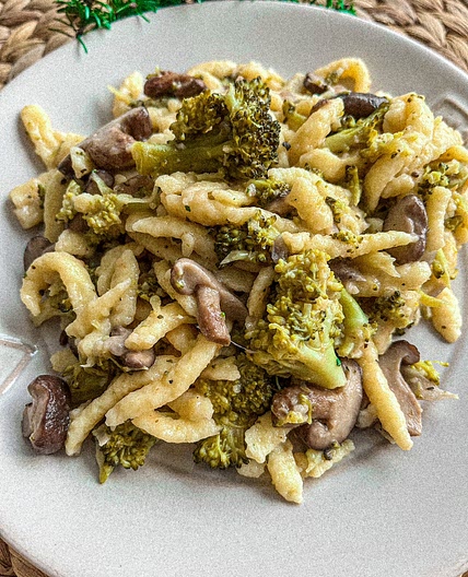 Egg Noodles (Spätzle) with shiitake mushrooms and broccoli in a cheesy sauce