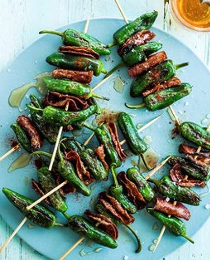 Grilled padron peppers and chorizo skewers with honey drizzle