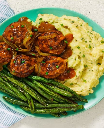 Gravy-Smothered Meatballs over Chive Mashed Potatoes with Roasted Green Beans