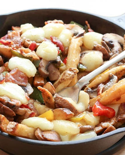 Montreal-Style Poutine with Bacon, Peppers, Mushrooms, and Onions