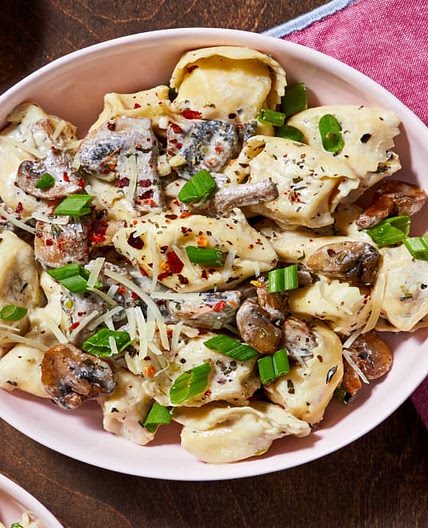 Cheese Tortelloni with Mushroom Sauce, Parmesan, and Chili Flakes