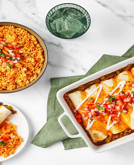 David Burtka’s Cheesy Chicken & Bean Enchiladas with Tomato Rice, Pico de Gallo & Lime Crema