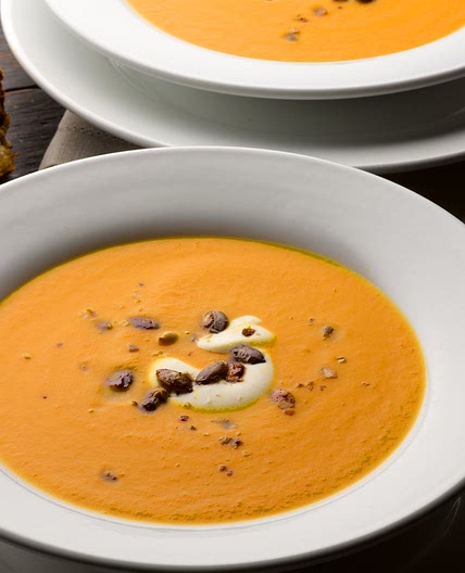 Pumpkin, saffron and orange soup with caramelised pumpkin seeds