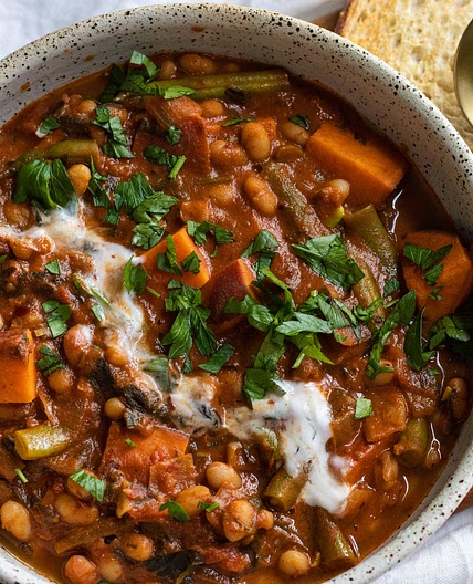 sweet potato and white bean stew with harissa and tahini (vegan)