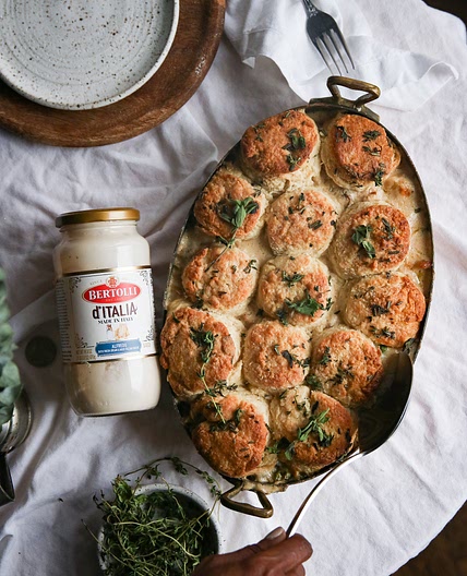 Creamy Chicken Alfredo Pot Pie topped with Buttermilk Biscuits