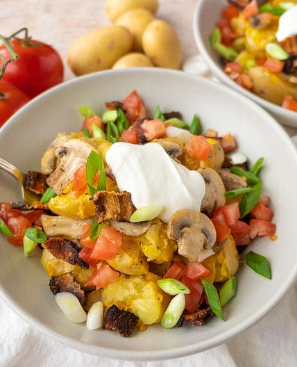 Cheesy Smashed Potatoes with Bacon, Mushrooms, Tomato & Green Onion