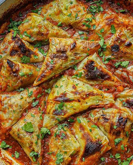 Chickpea & Rice Stuffed Leeks in Aromatic Spiced Tomato Sauce