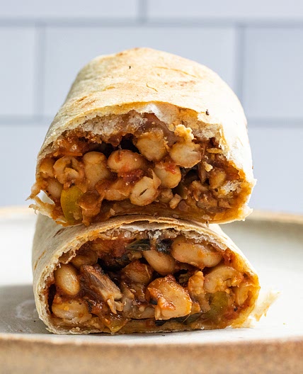 vegan pizza wrap with mushrooms and white beans