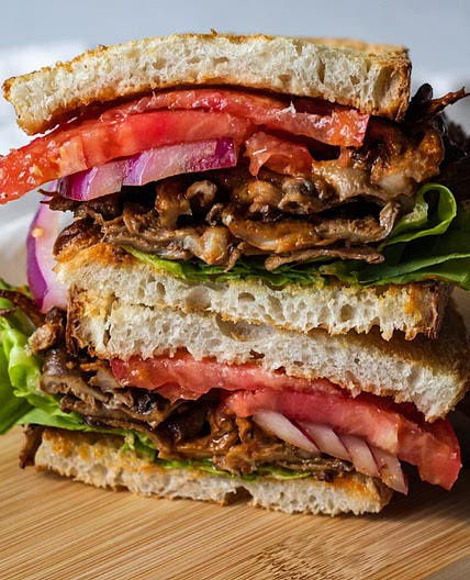 vegan buffalo chicken sandwich with oyster mushrooms