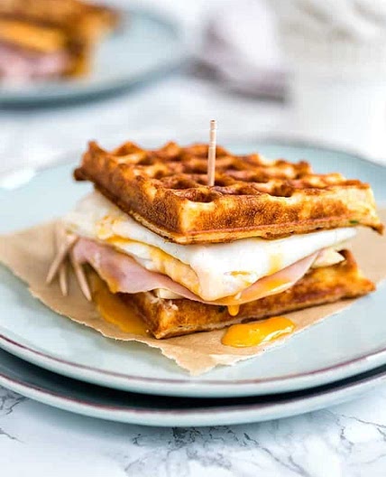 Parmesan waffle, ham, cheese and egg breakfast sandwich