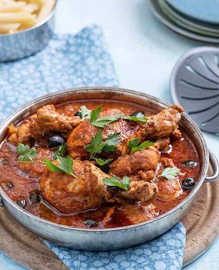 Chicken drumsticks in spicy puttanesca sauce