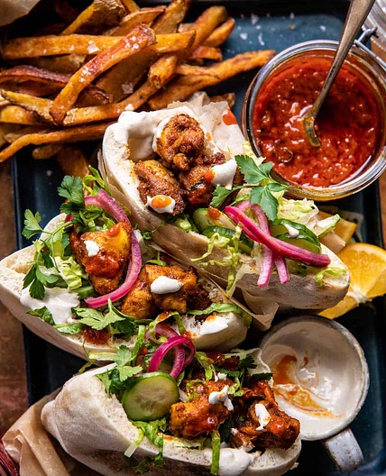 Roasted Turmeric Chicken Pitas with Garlic Lemon Tahini