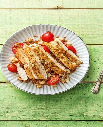 Pan-Seared Chicken with Herbs De Provence Over a Warm Farro, Mozzarella, and Tomato Jumble