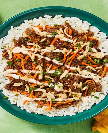 Sesame-Soy Beef Bowls with Jasmine Rice, Sriracha Mayo, Cilantro & Crispy Fried Onions