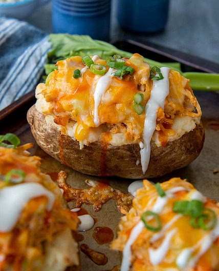 Cheesy Buffalo Chicken Baked Potatoes