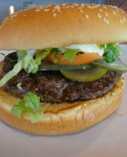 beef burger with tomato salad