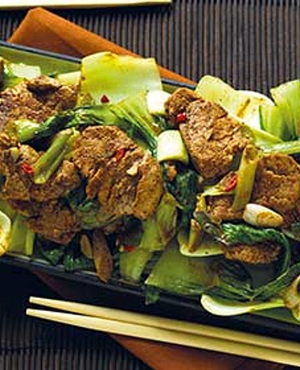 Spicy ginger and garlic pork with pak choi