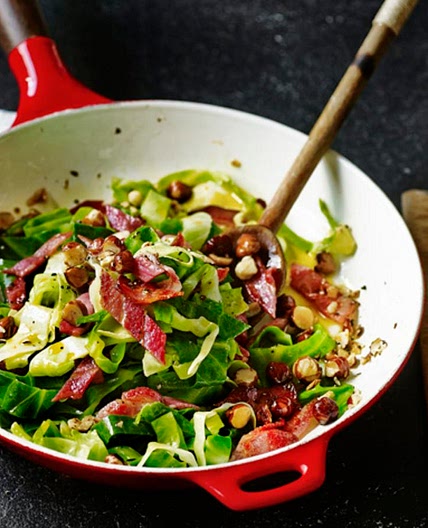 Greens with bacon and hazelnuts