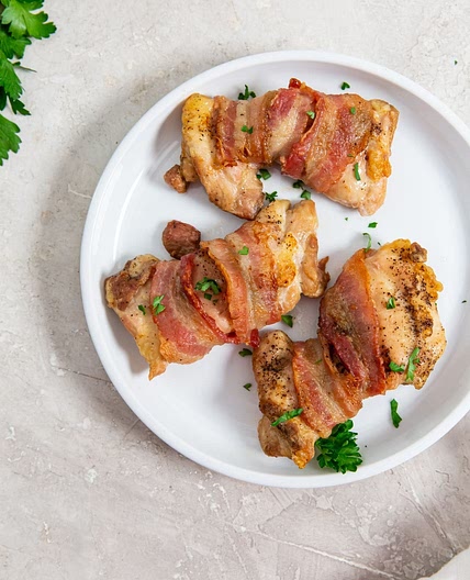 Air Fryer Bacon Wrapped Chicken Thighs