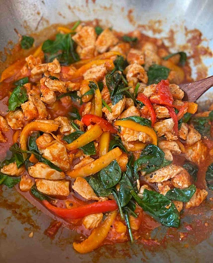 Tomato Chicken with spinach and bell peppers
